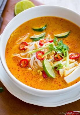  Laksa Johor - A Creamy Coconut Curry Broth Explosion Meets Tangy, Aromatic Fish Paste Delight!