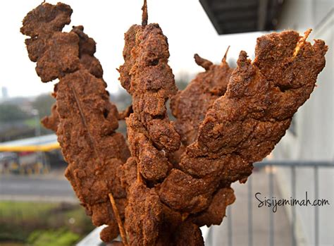 Suya, a Smoky Delicacy Roasted to Perfection and Drizzled with Spicy Peanut Sauce!